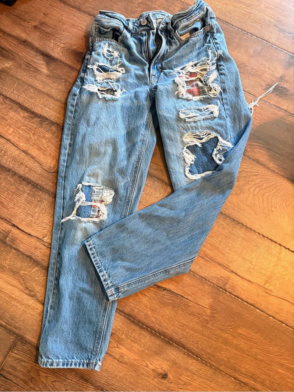 American Eagle Outfitters Light Blue Distressed Jeans with Red Plaid Patch